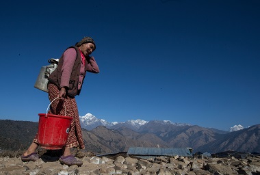 Women lugging water; Image UNICEF